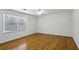 Bright bedroom with hardwood floors, neutral walls, and natural light filling the space from a window at , Dunwoody, GA 30338