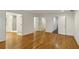 Spacious room with hardwood floors and multiple doorways leading to additional spaces at , Dunwoody, GA 30338