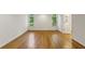 Bright bedroom featuring hardwood floors, neutral paint, and natural light from two arched windows at , Dunwoody, GA 30338