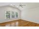 Bright bedroom with ceiling fan, vaulted ceiling, and natural light from three windows at , Dunwoody, GA 30338