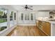 Eat-in kitchen area featuring bright windows, white shutters, and hardwood floors at , Dunwoody, GA 30338