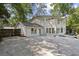 Charming two-story home with a white exterior, a large backyard, and ample parking space at , Dunwoody, GA 30338
