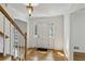 Inviting foyer featuring hardwood floors, staircase, and a door with sidelights, enhancing the home's appeal at , Dunwoody, GA 30338
