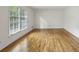 Bright and airy living room with hardwood floors, large windows, and neutral walls at , Dunwoody, GA 30338