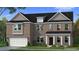 Charming two-story brick home features a traditional design with a two-car garage and well-maintained landscaping at 2516 Cadenza Cir, Dacula, GA 30019