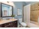 Elegant bathroom with tile shower, stylish vanity, and well-lit mirror at 496 Rankin Ne St, Atlanta, GA 30308