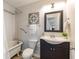 Bathroom features classic clawfoot tub, modern vanity, and a decorative mirror at 496 Rankin Ne St, Atlanta, GA 30308