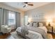 Comfortable bedroom with gray accents, hardwood flooring, and natural light from a window at 496 Rankin Ne St, Atlanta, GA 30308