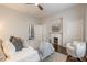 Comfortable bedroom with fireplace, hardwood floors, and a cozy armchair at 496 Rankin Ne St, Atlanta, GA 30308