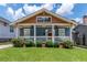 Charming blue craftsman home with a welcoming front porch and meticulously maintained landscaping at 496 Rankin Ne St, Atlanta, GA 30308