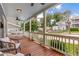 Inviting front porch with a porch swing, seating, and ceiling fans, perfect for relaxing outdoors at 496 Rankin Ne St, Atlanta, GA 30308