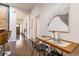Hallway with chair height table and seating, and views into the kitchen and front entry at 496 Rankin Ne St, Atlanta, GA 30308