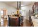 Open kitchen with bar and stainless steel appliances and view to the connected room at 496 Rankin Ne St, Atlanta, GA 30308