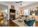 Comfortable living room with brick fireplace, built-in shelves, and hardwood flooring at 496 Rankin Ne St, Atlanta, GA 30308