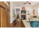 Bright, open living room with hardwood floors, fireplace and TV, flowing into other living spaces at 496 Rankin Ne St, Atlanta, GA 30308