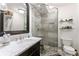 Modern bathroom featuring a glass-enclosed shower, and a marble countertop sink at 657 E Paces Ferry Ne Rd, Atlanta, GA 30305
