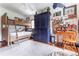 Bedroom with built-in bunk beds, hardwood floors, and a large blue cabinet at 657 E Paces Ferry Ne Rd, Atlanta, GA 30305