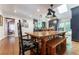 Inviting dining room featuring hardwood floors, a rustic table, and modern lighting at 657 E Paces Ferry Ne Rd, Atlanta, GA 30305