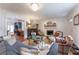 Bright living room featuring a fireplace, chandelier, and hardwood floors at 657 E Paces Ferry Ne Rd, Atlanta, GA 30305