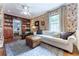 Inviting living room with patterned wallpaper, hardwood floors, and built-in bookcases at 657 E Paces Ferry Ne Rd, Atlanta, GA 30305