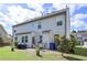 Backyard featuring outdoor dining on the patio, grill, and spacious yard at 110 Serendipity Way, Dallas, GA 30157