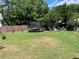 Expansive backyard featuring a well-maintained lawn, trampoline and additional seating area at 110 Serendipity Way, Dallas, GA 30157