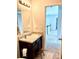Modern bathroom with granite countertop, dark wood vanity, and neutral color palette at 110 Serendipity Way, Dallas, GA 30157