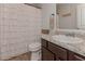 Comfortable bathroom features a stylish sink, a toilet, and a ruffled shower curtain adding an elegant touch at 110 Serendipity Way, Dallas, GA 30157