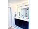 Modern bathroom features a double sink vanity and a large mirror at 110 Serendipity Way, Dallas, GA 30157