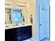 Bathroom features double sinks, a large mirror, and a neutral color palette at 110 Serendipity Way, Dallas, GA 30157