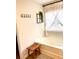Bright bathtub with stylish sheer curtains and decorative hanging plant at 110 Serendipity Way, Dallas, GA 30157