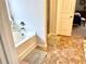 Bright bathroom with a bathtub and glass shower at 110 Serendipity Way, Dallas, GA 30157