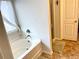 Bright bathroom with a bathtub and glass shower at 110 Serendipity Way, Dallas, GA 30157