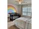 Bright Bedroom with rainbow wall art, a dark wood crib, and natural light from the large window at 110 Serendipity Way, Dallas, GA 30157