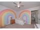 Bright bedroom featuring creative rainbow wall art, neutral carpet, and a serene atmosphere at 110 Serendipity Way, Dallas, GA 30157