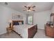 Traditional bedroom with a dark wood bed frame, soft natural light, and hardwood dresser at 110 Serendipity Way, Dallas, GA 30157