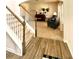 Inviting entryway features wood floors and carpeted stairs leading into a carpeted living area with stylish furnishings at 110 Serendipity Way, Dallas, GA 30157