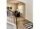 Inviting entryway showcasing hardwood floors, carpeted stairs, and a cozy living area with ample natural light at 110 Serendipity Way, Dallas, GA 30157