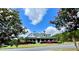 A charming home is surrounded by flowering trees, enhancing its curb appeal at 110 Serendipity Way, Dallas, GA 30157
