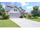 Charming two-story home with attached garage, manicured lawn, and inviting front porch at 110 Serendipity Way, Dallas, GA 30157