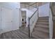Elegant foyer with staircase and wood floors offering a view into the home at 110 Serendipity Way, Dallas, GA 30157