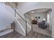 Elegant foyer with staircase, wood floors, and view into the sitting room at 110 Serendipity Way, Dallas, GA 30157