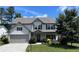 Beautiful two-story home with a covered porch, landscaped yard, and a two-car garage at 110 Serendipity Way, Dallas, GA 30157