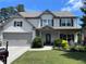 Charming two-story home featuring a well-manicured lawn and inviting front porch at 110 Serendipity Way, Dallas, GA 30157