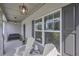 Inviting front porch with a seating area, ambient lighting, and stone accents at 110 Serendipity Way, Dallas, GA 30157