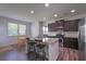 Eat-in kitchen featuring granite counters, stainless appliances and hardwood floors at 110 Serendipity Way, Dallas, GA 30157