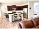 Kitchen features granite island with seating and stainless steel appliances at 110 Serendipity Way, Dallas, GA 30157