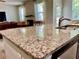 Granite countertop of kitchen island with stainless steel sink and faucet at 110 Serendipity Way, Dallas, GA 30157