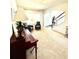 A cozy living room and entryway with a piano, comfortable seating, and plenty of natural light at 110 Serendipity Way, Dallas, GA 30157
