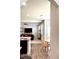Open-concept living room with eat-in kitchen featuring a fireplace and hardwood floors at 110 Serendipity Way, Dallas, GA 30157
